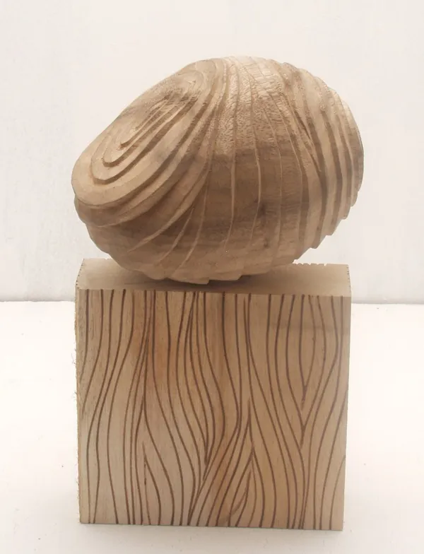 Carved Wooden Egg on Block