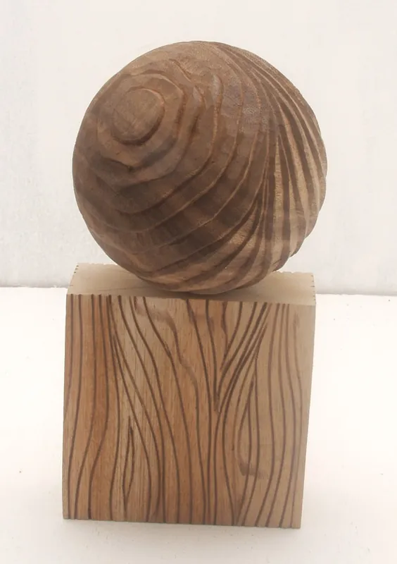 Carved Wooden Sphere on Block